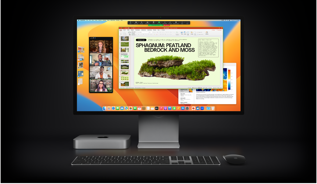 Mac mini z myszą Magic Mouse, klawiaturą Magic Keyboard i monitorem Studio Display pokazującym prezentację Microsoft PowerPoint udostępnianą podczas spotkania w narzędziu Zoom, z widoczną w tle aplikacją Notatki.
